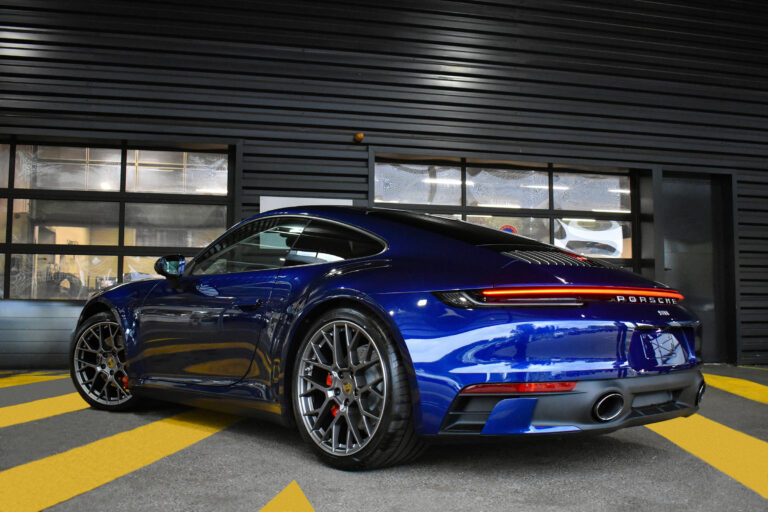 Dark blue Porsche in garage with premium Paint Protection Film for Cars, showcasing its sleek design and enhanced durability