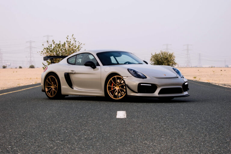 A grey Porsche in the desert showcases the superior protection of Paint Protection Film for Cars against harsh elements